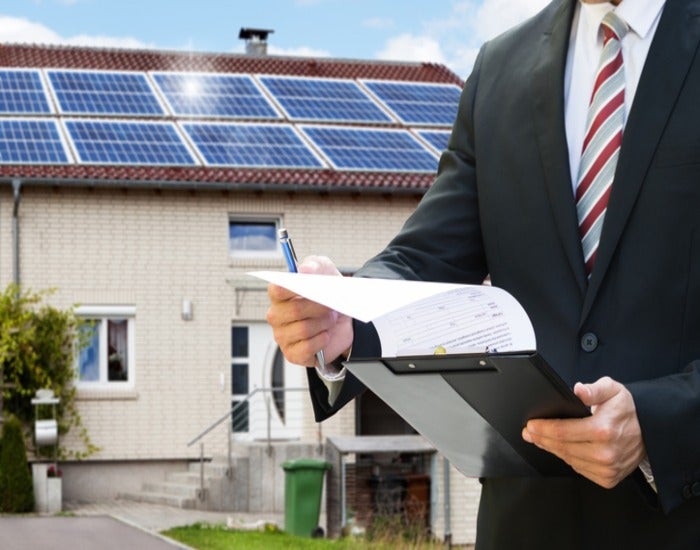 Professional assessment of residential solar panels on a home in Atlanta, GA
