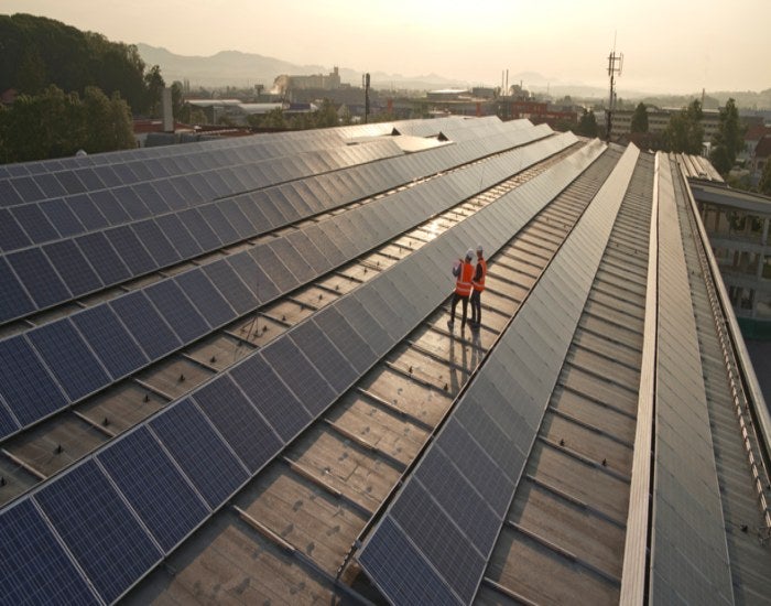 Workers checking out the solar panel size guide in Atlanta, GA

