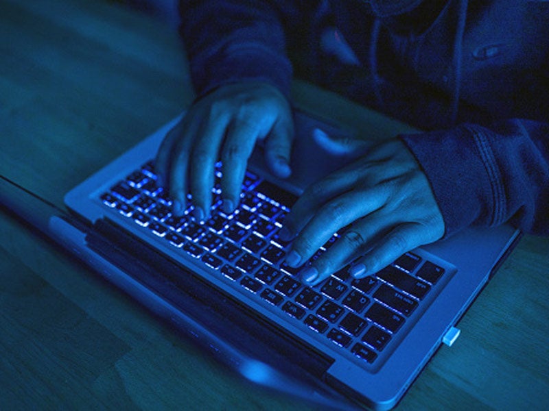 Man working on a laptop in Atlanta, GA 